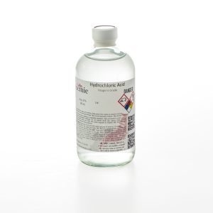 A 480mL clear glass bottle of Alchemie Labs hydrochloric acid, reagent grade, with a detailed label including safety instructions.