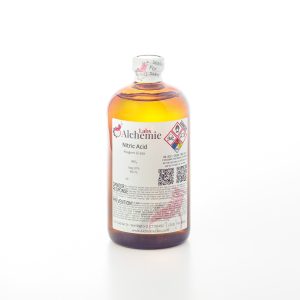 A 950mL amber bottle of Alchemie Labs reagent grade nitric acid, sealed for safety with detailed chemical labeling.