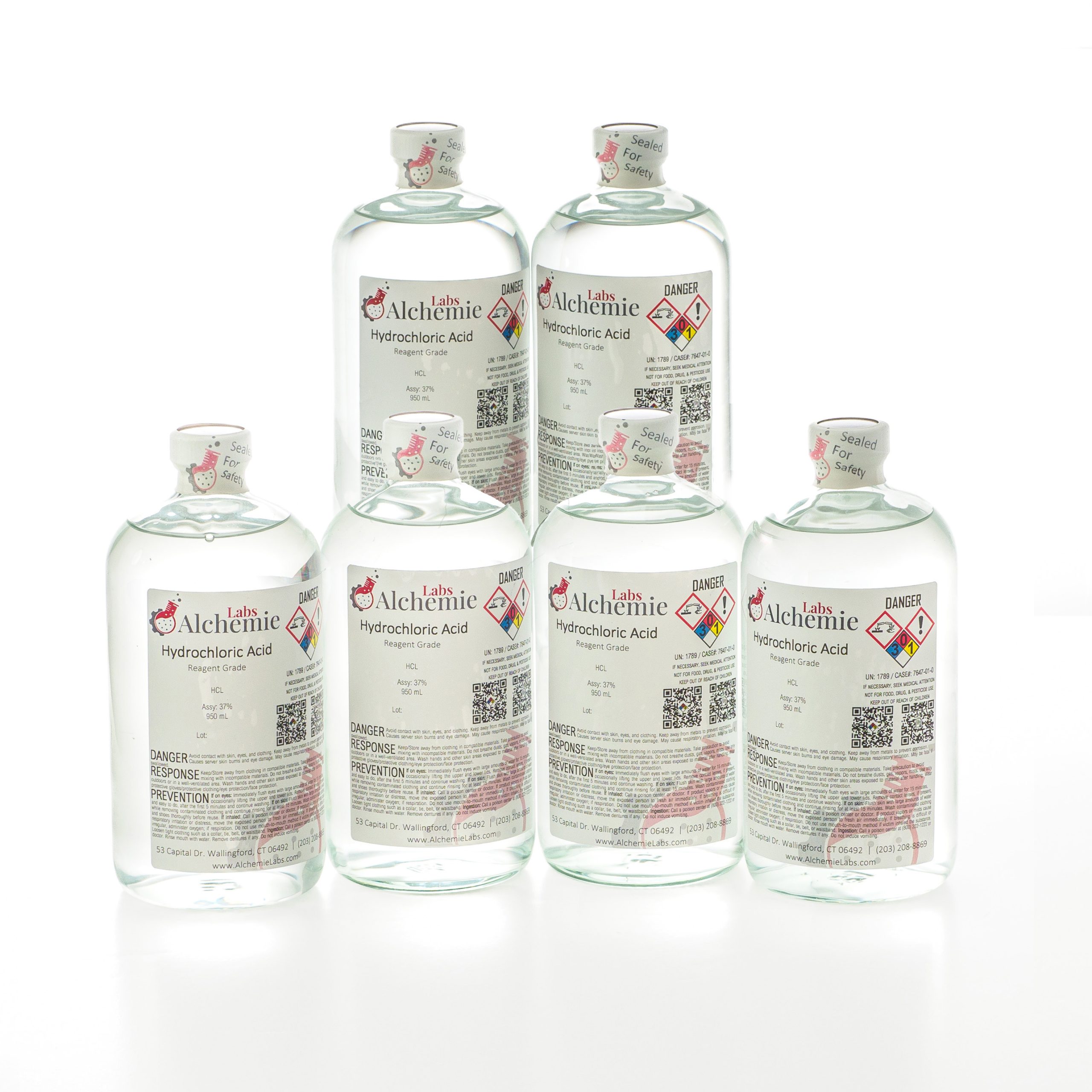 Six 950mL clear glass bottles of Alchemie Labs hydrochloric acid, each marked with reagent grade labels and safety seals.