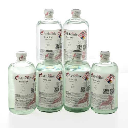 Six 950mL reagent grade nitric acid bottles from Alchemie Labs, each with detailed labeling and safety seals.